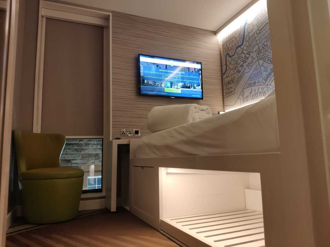 Premier Inn Hub standard room showing bed with smart screen room controls