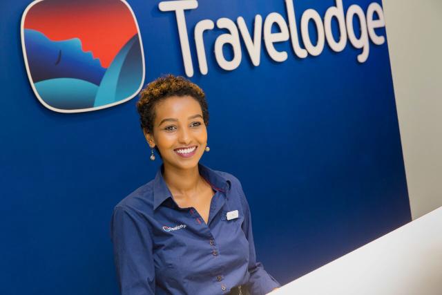 Travelodge-reception-staff-checking-out-guests